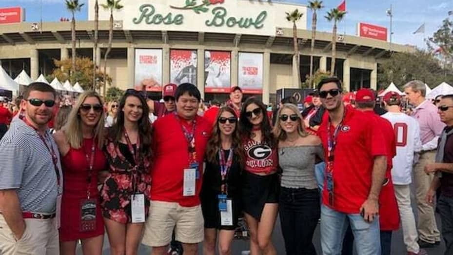 Zhong pictured with a group of friends at the 2018 Rose Bowl game.