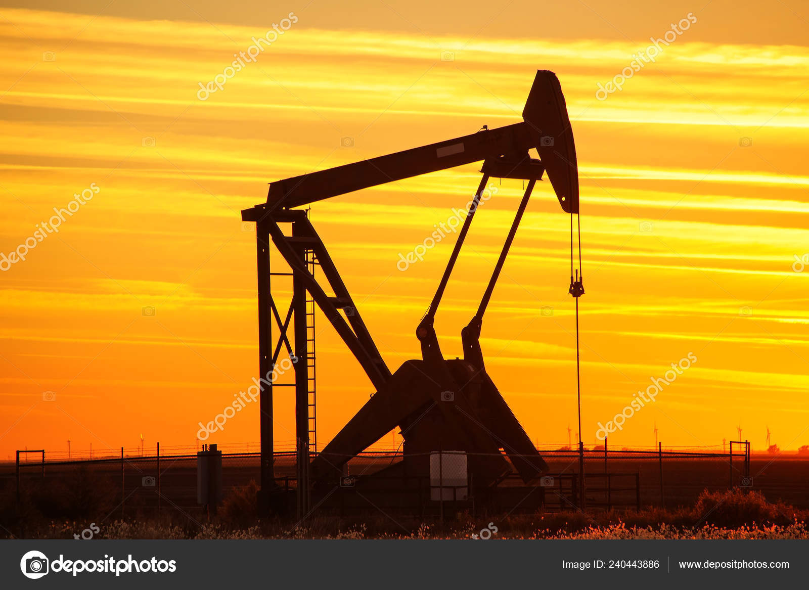 https://st4.depositphotos.com/1702382/24044/i/1600/depositphotos_240443886-stock-photo-silhouetted-pump-jack-oil-field.jpg